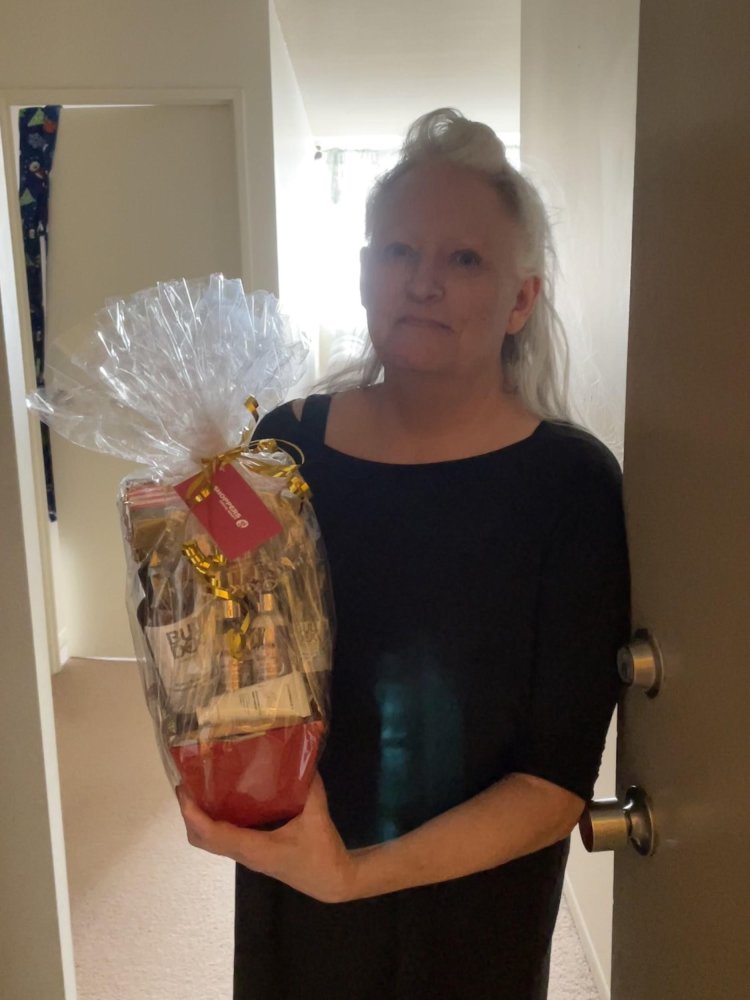 Quiz-winner Carol Chisholm with her prize of a Men’s Beauty Basket, courtesy of Shoppers Drug Mart.